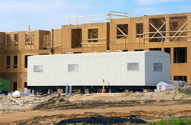 construction workers discussing plans in a rental office in Slingerlands